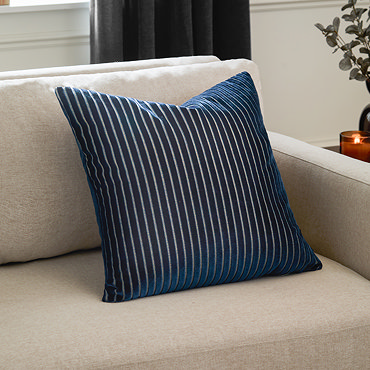 front image of navy blue square cushion with vertical stripe detail, cut out on white background