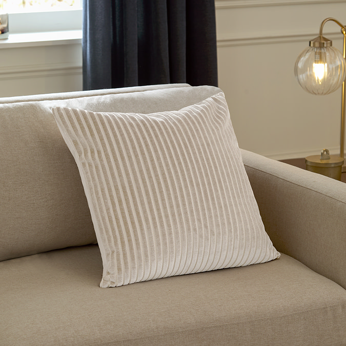 55x55cm oyster cream cushion with vertical stripe detail, sat in corner of cream sofa