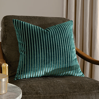 55x55cm teal green cushion with vertical stripe detail, sat on dark khaki chair