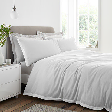 Seersucker woven stripe bedding in grey on bed image 2