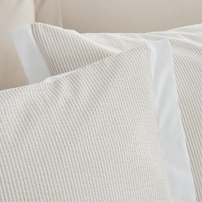 seersucker woven stripe natural duvet cover set close up on bed image 4