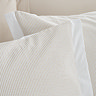 seersucker woven stripe natural duvet cover set close up on bed image 4