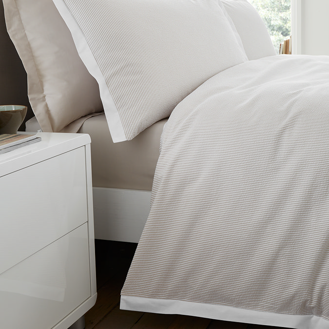 seersucker woven stripe natural duvet cover set close up on bed image 5