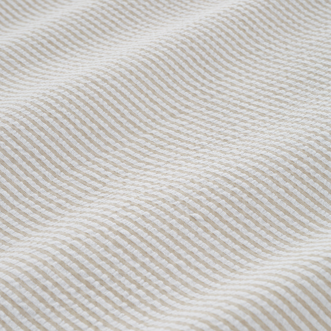 seersucker woven stripe natural duvet cover set close up on bed image 6
