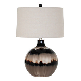 image cut out on white background of brown glass lamp with linen shade