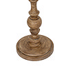 close up on brown base of floor lamp with rustic effect and curved details