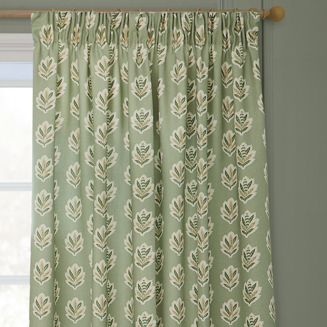 Sessile Leaf Sage Green Pencil Pleat Curtains over a window close up image