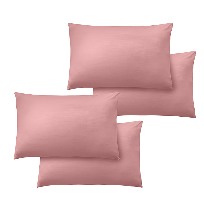 4 pillows with coral pink pillowcases, image cut out on white background
