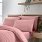 4 pillows covered with coral pink pillowcases on bed