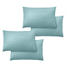image cut out on white background of four duck egg blue pillowcases over pillows