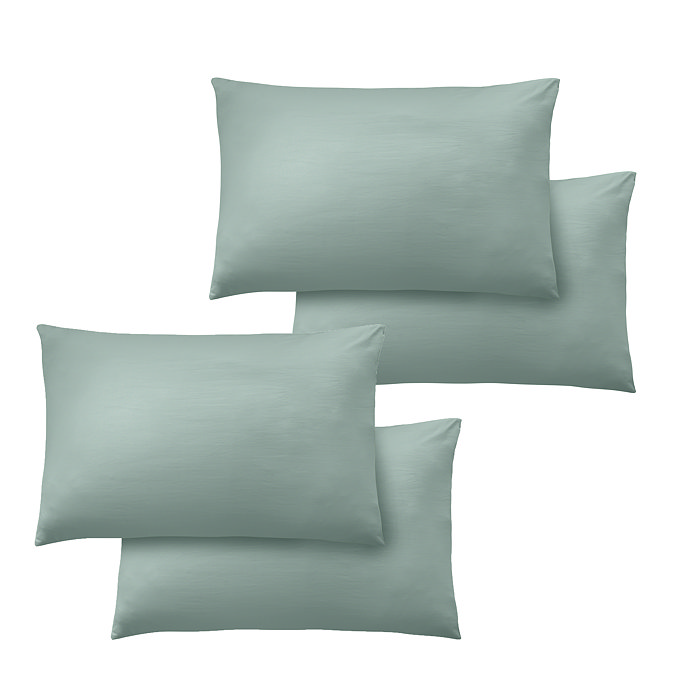 pair of 4 soft green pillowcases, image cut out on white background