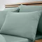 set of 4 light green pillowcases on bed with matching fitted sheet
