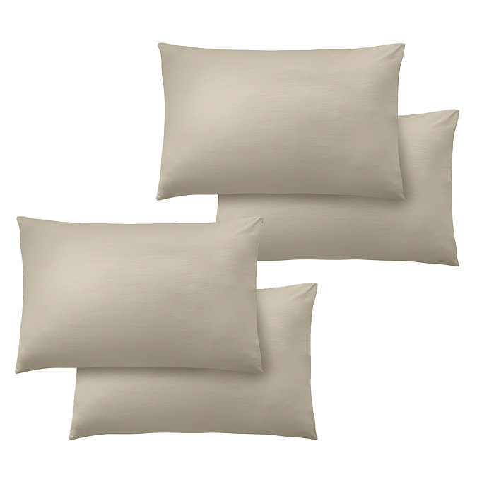 image cut out on white background of four natural coloured pillowcases