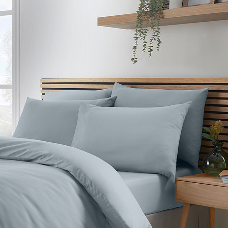 Set of 4 pillowcases on bed image 1