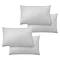 image cut out on plain background of four white pillowcases in two pairs