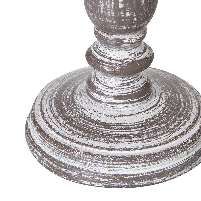 close up image of lamp base with weathered white and grey effect