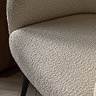 close up on faux sheepskin seat of ivory accent chair