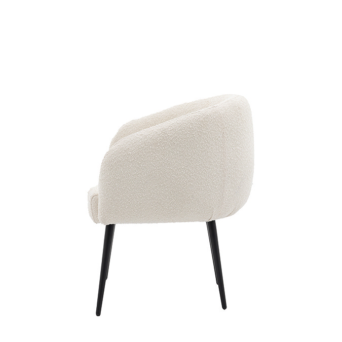 side on cut out image of faux sheepskin tub accent chair with black legs
