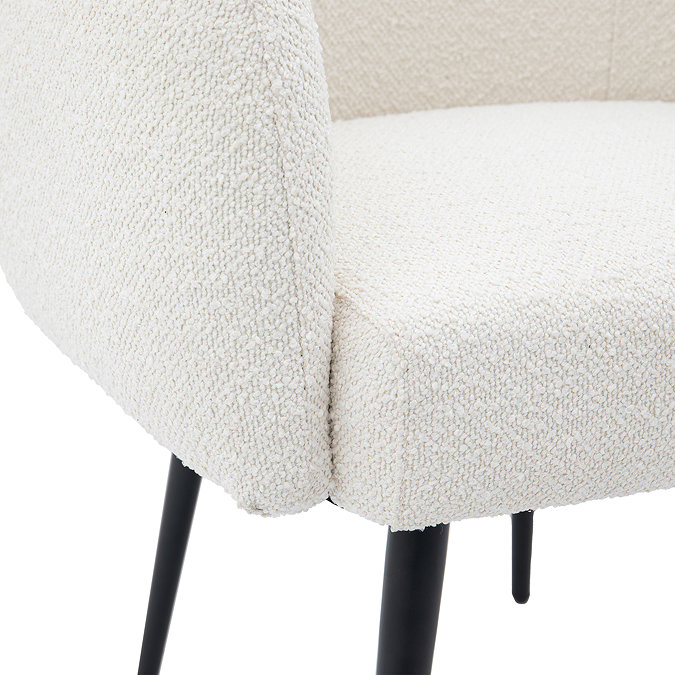 close up image of boucle-style material of accent chair seat