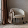 image of faux sheepskin tub chair with sleek black legs
