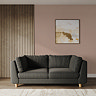 lifestyle image of large chunky moleskin sofa with light beech legs