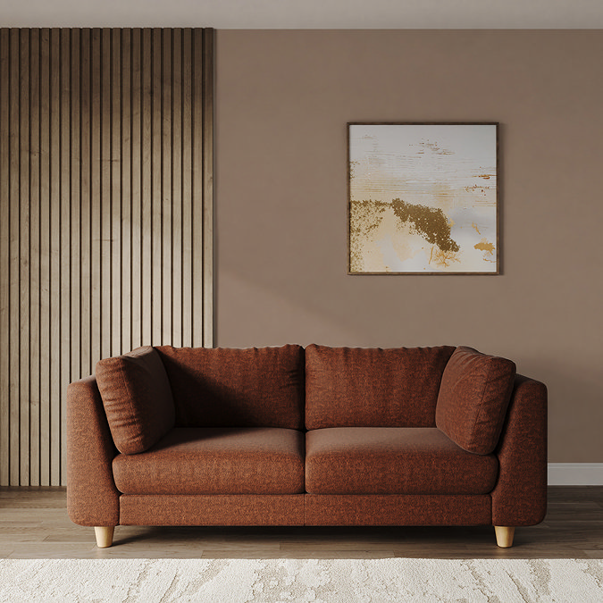 lifestyle image of large chunky pumpkin sofa with light beech legs
