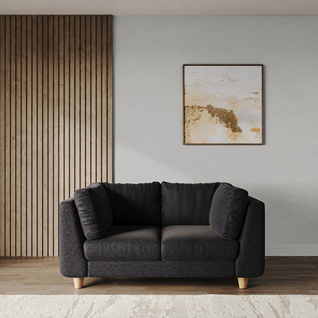 lifestyle image of chunky indigo sofa with light beech legs