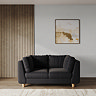 lifestyle image of chunky indigo sofa with light beech legs