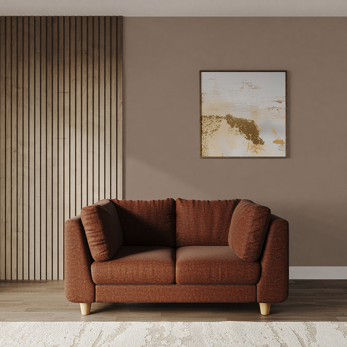 lifestyle image of medium chunky sofa in pumpkin with light beech legs