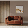 lifestyle image of medium chunky sofa in pumpkin with light beech legs