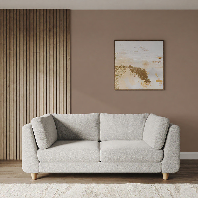 lifestyle image of large chunky soft boucle sofa with beech legs