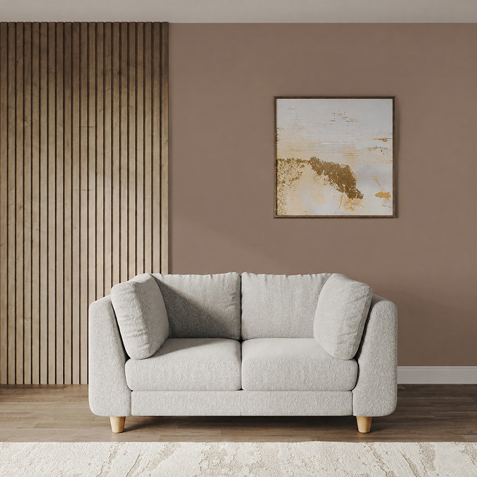 lifestyle image of medium chunky sofa in cocoon boucle with light beech legs