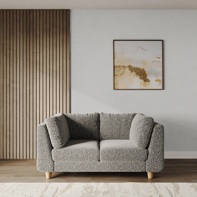 lifestyle image of medium chunky sofa in mist boucle with light beech legs
