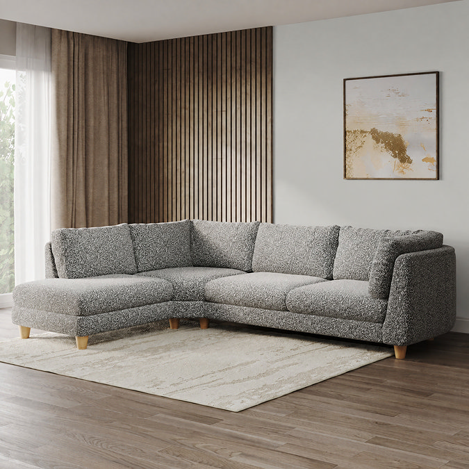lifestyle image of chunky right sofa in mist boucle with light beech legs