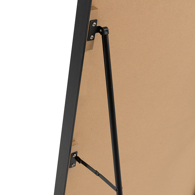 close up image on stand attached to back of full length mirror