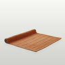 image of amber bath mat slightly rolled up at the end, on light grey background