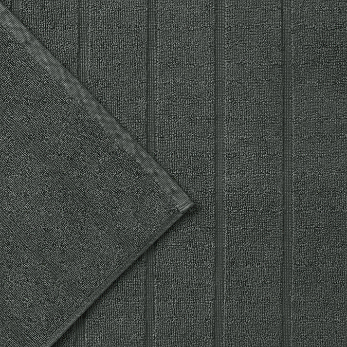 close up on ash grey bath mat with wide ribbed detailing 