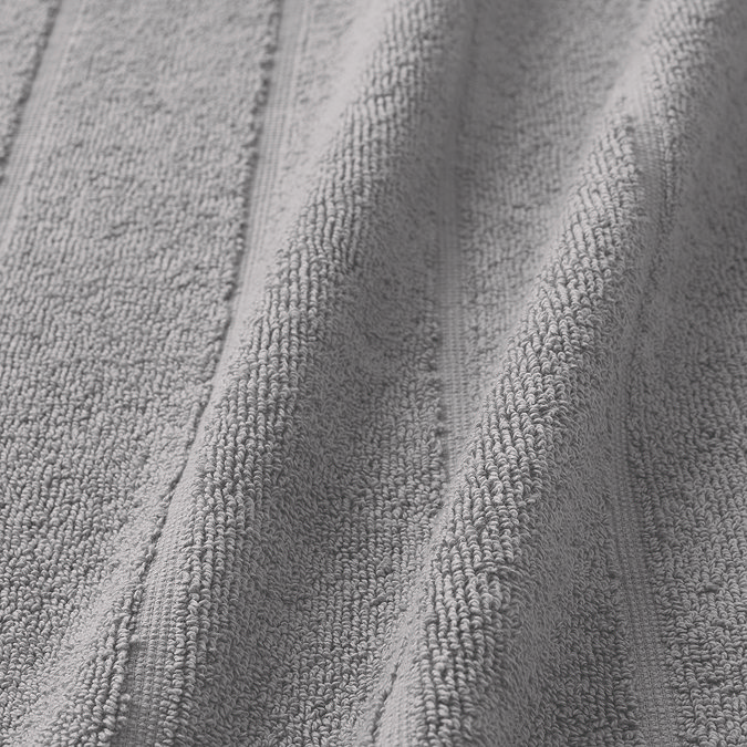 close up on texture and colour of light grey cotton math mat