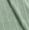 close up on texture and colour of jade green cotton a bath mat with striped detailing