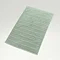 image of jade green bath mat on light grey background