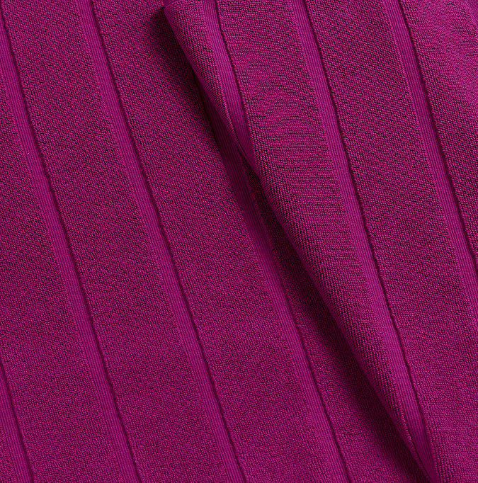 close up on colour and texture of plum bath mat
