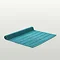 image of teal blue bath mat flat on light grey background