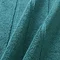 close up on texture and colour of teal blue bath mat