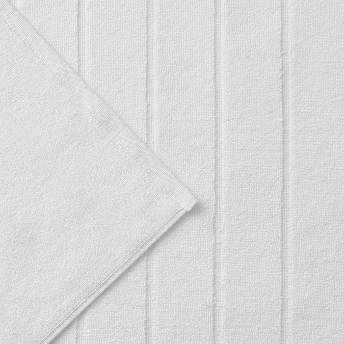 close up on texture of white bath mat