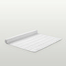 image of white bath mat rolled up on one end, on light grey background