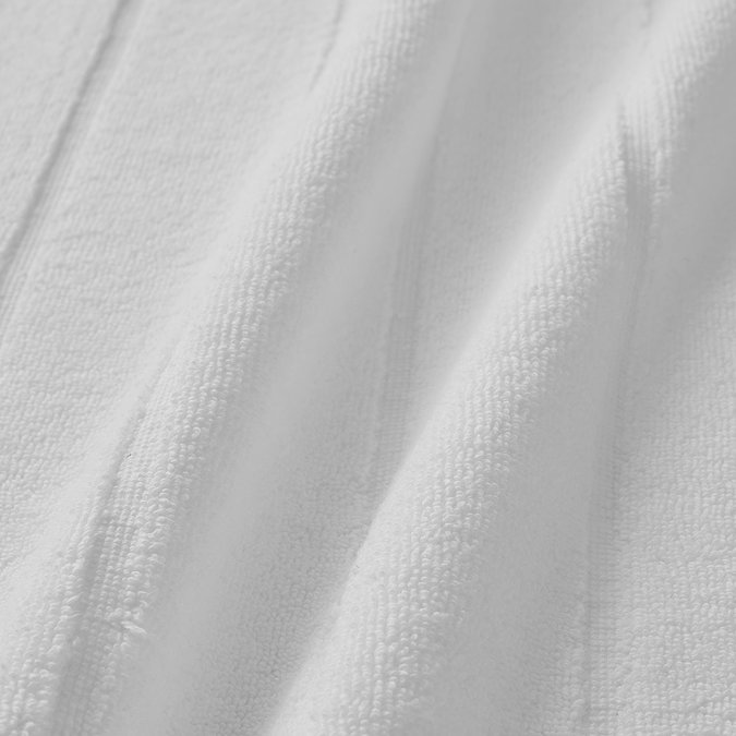 close up on texture and colour of white  cotton bath mat