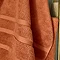 close up on weave detail of amber coloured towel