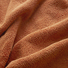 close up on texture of amber coloured towel