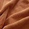 close up on texture of amber coloured towel