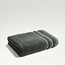 ash grey towel folded on light grey background
